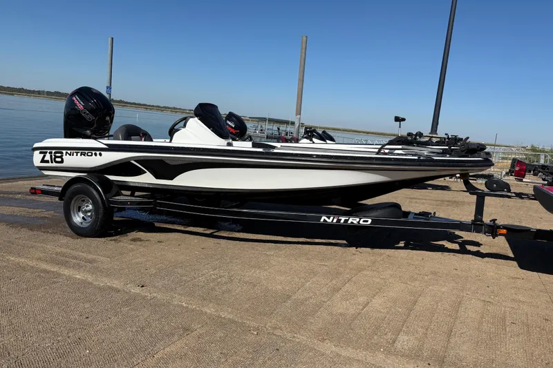 Slide: The Image of Boat trailer for Nitro Z18 Pro 2016 at a lakeside launch ramp. - 72