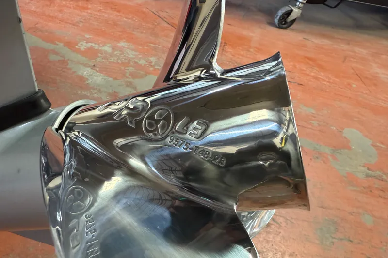 Slide: The Image of A 2016 Nitro Z18 Pro boat on a lake near a dock and trees. - 74