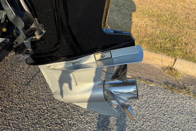 Slide: The Image of 2016 Nitro Z18 Pro fishing boat on trailer by a lake. - 9