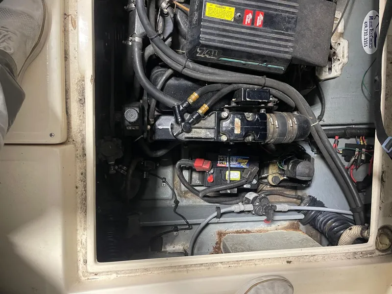 Slide: The Image of Engine compartment of a 1988 Sea Ray 268 Cruiser, showing detailed mechanical components. - 25
