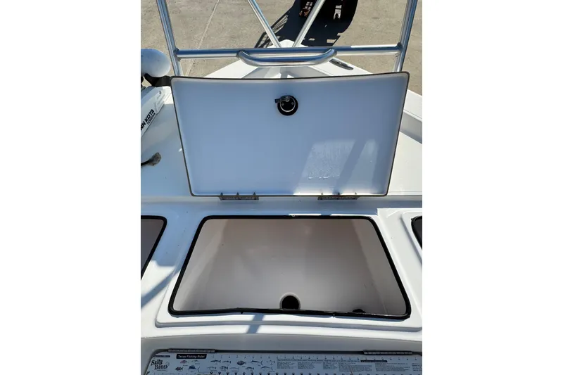 Slide: The Image of Open storage compartment on 2016 Blue Wave 2200 STL RISER boat. - 21