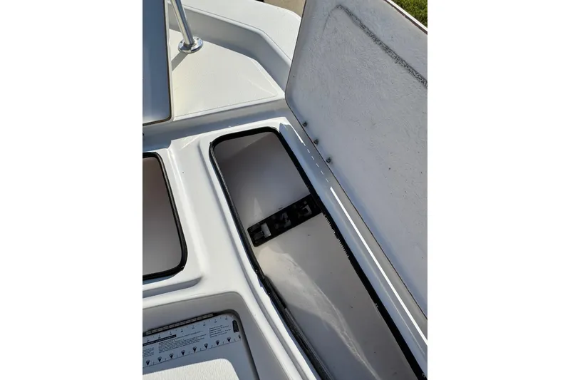 Slide: The Image of Open storage compartment on 2016 Blue Wave 2200 STL RISER boat deck. - 22