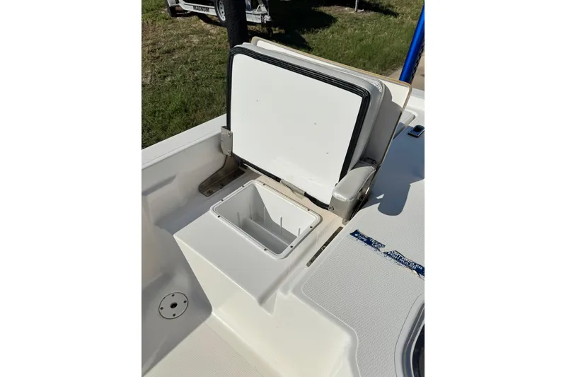 Slide: The Image of 2016 Blue Wave 2200 STL RISER boat with open storage compartment. - 29