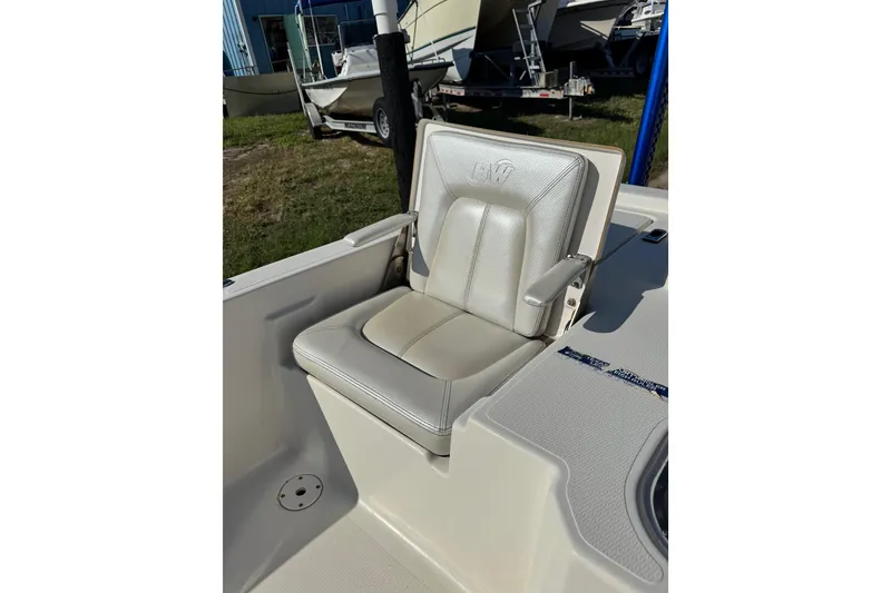 Slide: The Image of 2016 Blue Wave 2200 STL RISER boat seat with armrests, outdoor setting. - 30