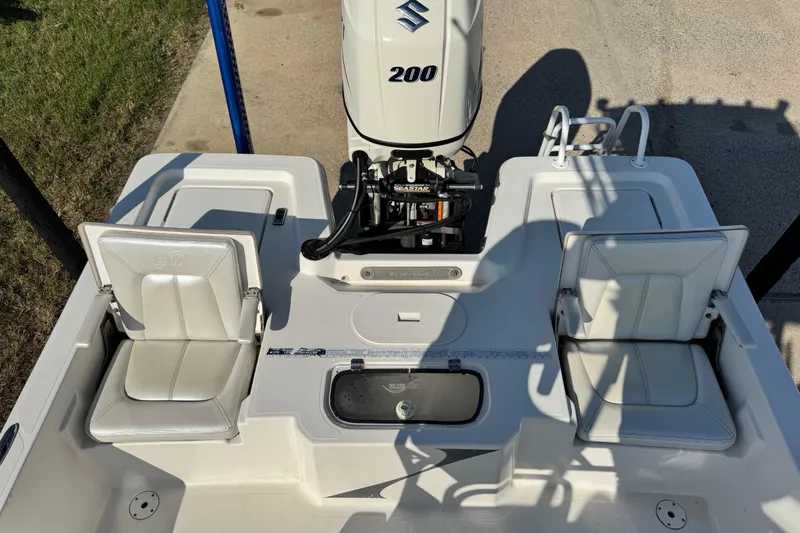 Slide: The Image of 2016 Blue Wave 2200 STL RISER boat with Suzuki 200 engine, featuring dual seats. - 33