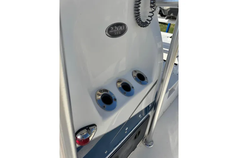 Slide: The Image of 2016 Blue Wave 2200 STL RISER boat console with rod holders and control panel. - 36