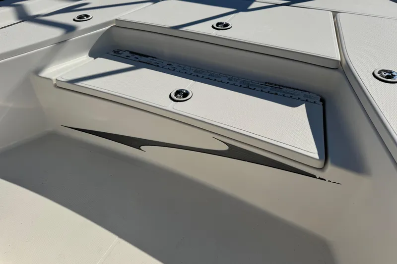 Slide: The Image of 2016 Blue Wave 2200 STL RISER boat deck with sleek design and storage compartments. - 38