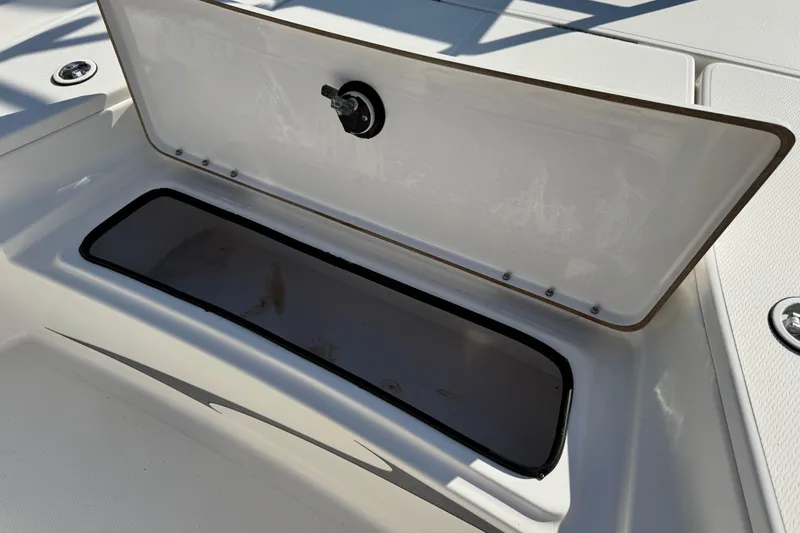 Slide: The Image of Open storage compartment on 2016 Blue Wave 2200 STL RISER boat. - 39