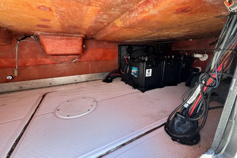 Slide: The Image of Underdeck view of a 2016 Blue Wave 2200 STL RISER boat, showing battery and wiring. - 49