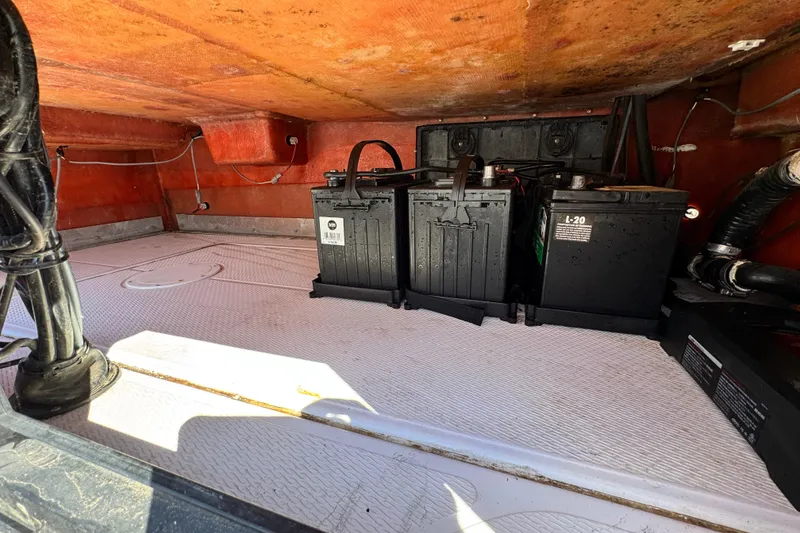 Slide: The Image of 2016 Blue Wave 2200 STL RISER boat battery compartment with dual batteries and wiring. - 50