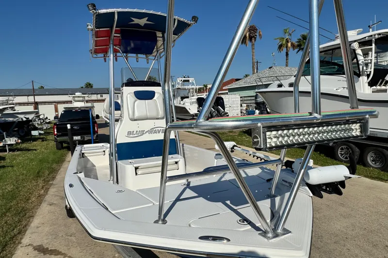 Slide: The Image of 2016 Blue Wave 2200 STL RISER boat with T-top and LED light bar. - 7