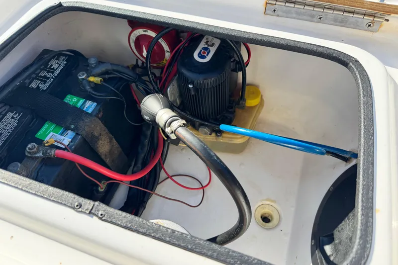 Slide: The Image of 2016 Blue Wave 2200 STL RISER boat battery compartment with wiring and components. - 8