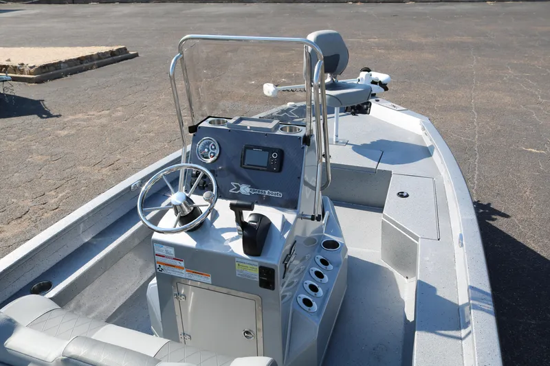 Slide: The Image of 2026 Xpress H20B Bay boat interior with steering console and seating. - 12