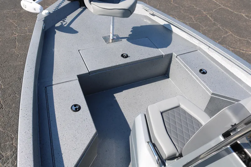 Slide: The Image of Open storage compartment on 2026 Xpress H20B Bay boat deck. - 14