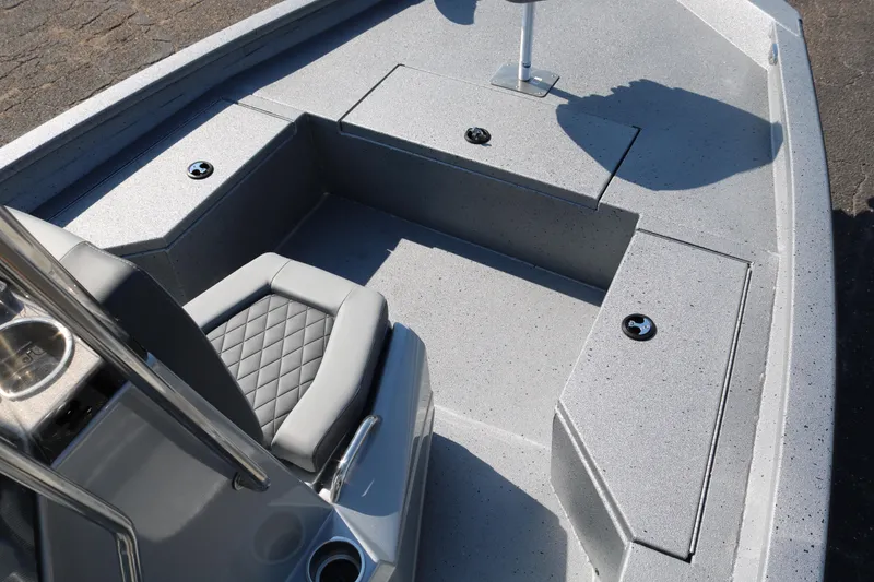 Slide: The Image of 2026 Xpress H20B Bay boat deck with seat and storage compartment. - 15