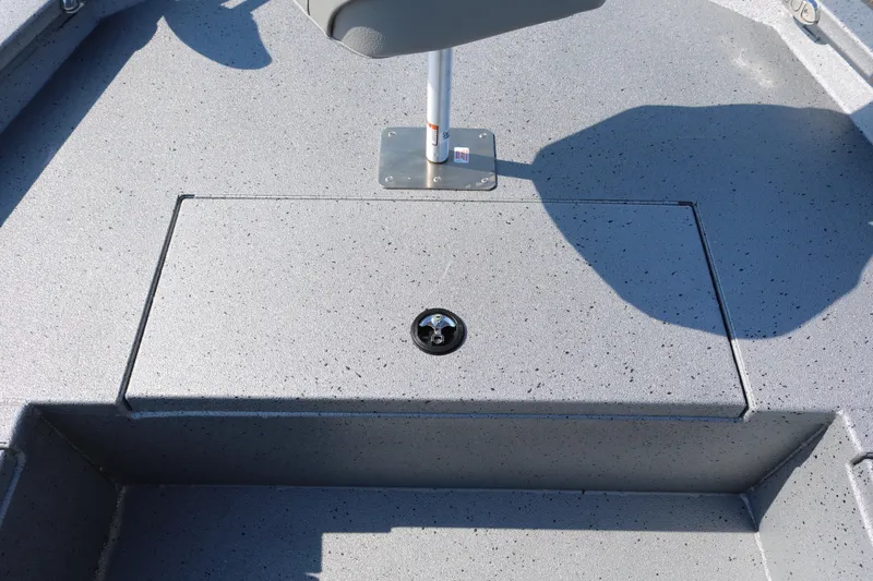 Slide: The Image of Open storage compartment on 2026 Xpress H20B Bay boat with stainless steel handles. - 22