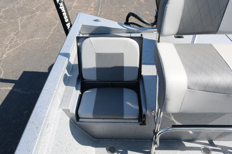 Slide: The Image of 2026 Xpress H20B Bay boat deck with storage compartments and seating. - 31