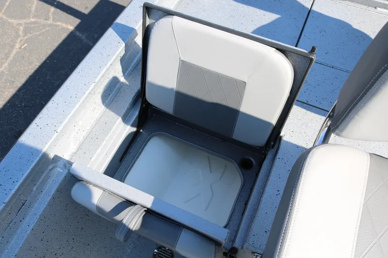 Slide: The Image of 2026 Xpress H20B Bay boat storage compartment with open lid, showcasing interior space. - 32