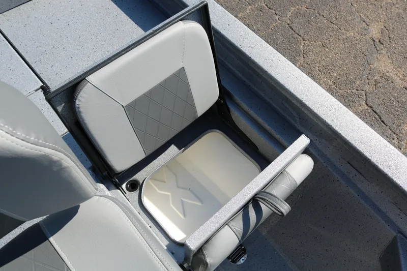 Slide: The Image of 2026 Xpress H20B Bay boat battery compartment with wiring and components. - 35