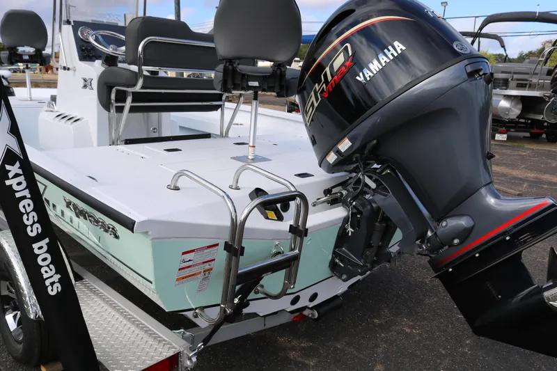 Slide: The Image of 2026 Xpress H20B Bay boat with Yamaha engine, featuring sleek design and modern seating. - 6