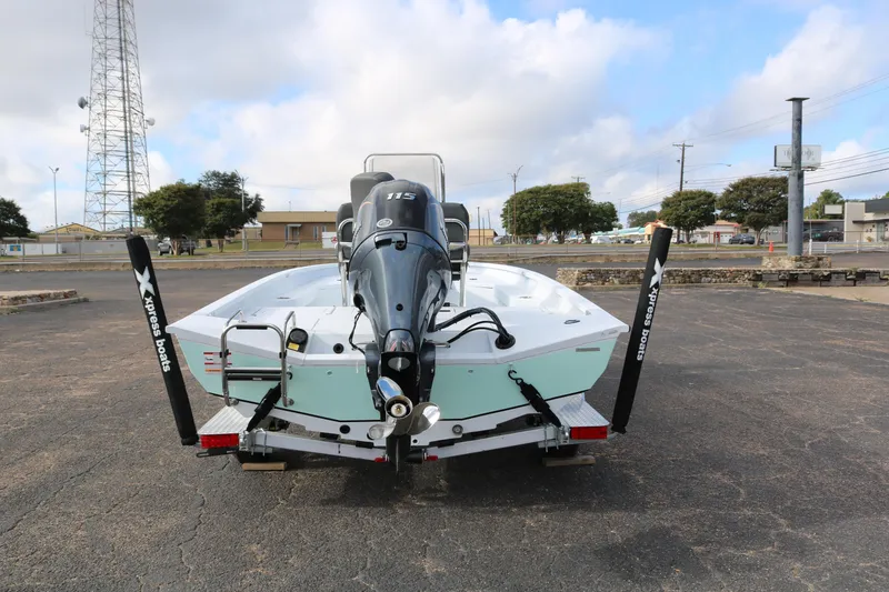 Slide: The Image of 2026 Xpress H20B Bay boat on trailer, rear view with outboard motor. - 8