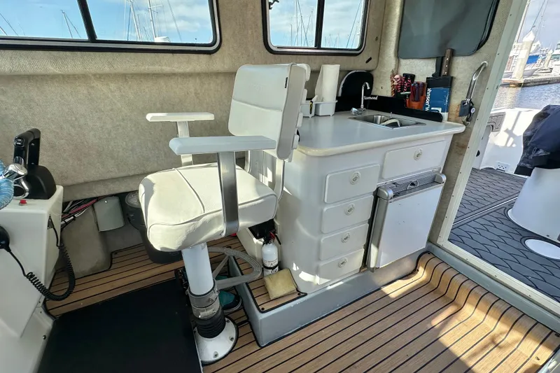 Slide: The Image of Interior of 2014 Parker 2530 Extended Cabin with seating and kitchenette. - 17