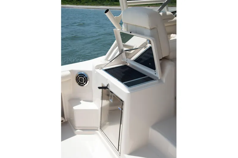 Slide: The Image of 2018 Grady-White Express 330 helm with steering wheel and control panel. - 45