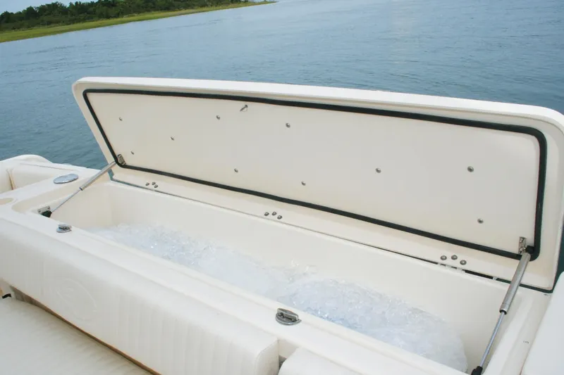 Slide: The Image of 2018 Grady-White Express 330 boat interior with white seating and steering wheel. - 47