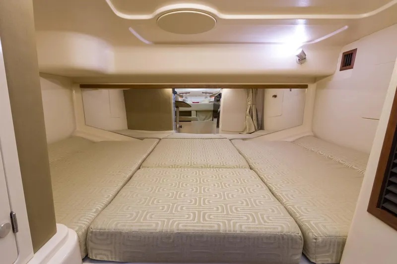 Slide: The Image of 2018 Grady-White Express 330 cabin interior with spacious sleeping area. - 53