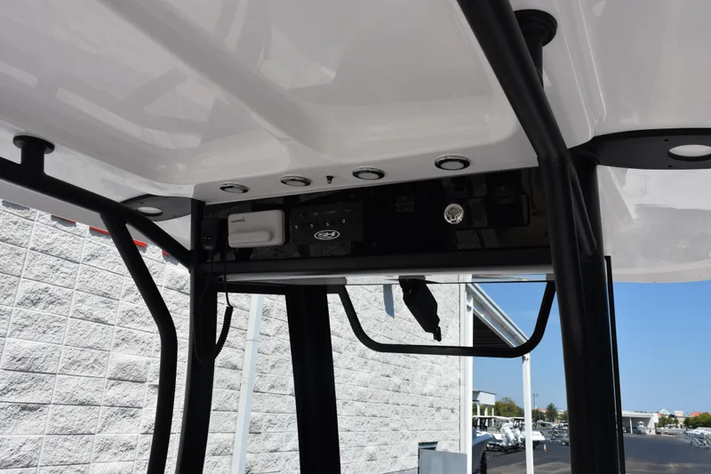 Slide: The Image of 2026 Sea Hunt Gamefish 27 boat console with electronics and sturdy frame. - 10