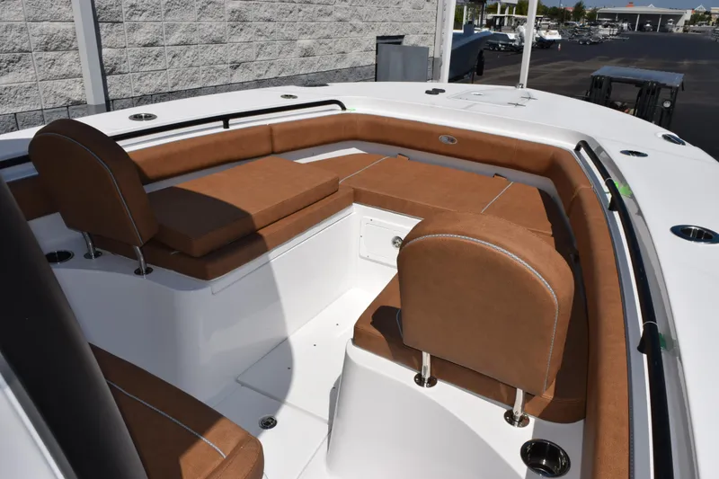 Slide: The Image of 2026 Sea Hunt Gamefish 27 Forward Seating with brown cushions and white deck. - 14