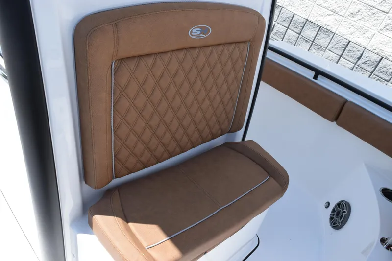 Slide: The Image of 2026 Sea Hunt Gamefish 27 Forward Seating with brown cushioned seat detail. - 15