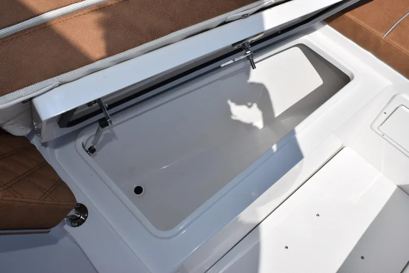Slide: The Image of Open storage compartment on 2026 Sea Hunt Gamefish 27 Forward Seating boat. - 18
