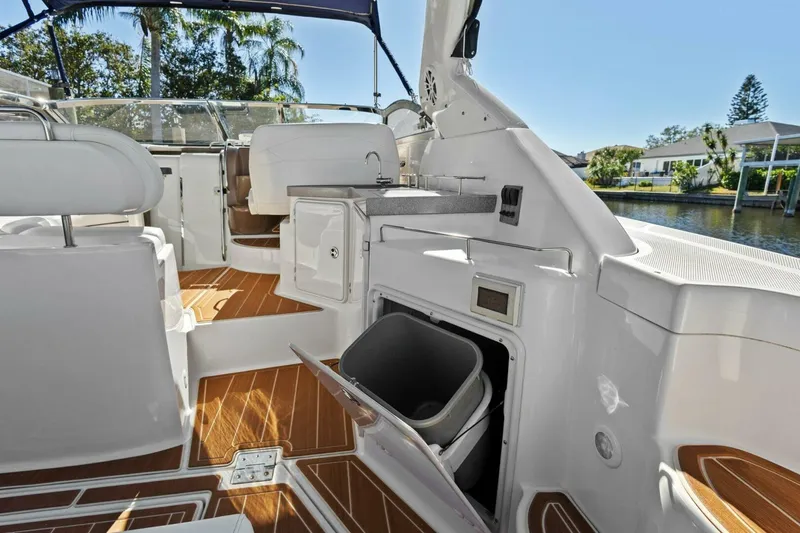 Slide: The Image of 2005 Regal Commodore 3560 yacht interior with sleek design and wooden flooring. - 16