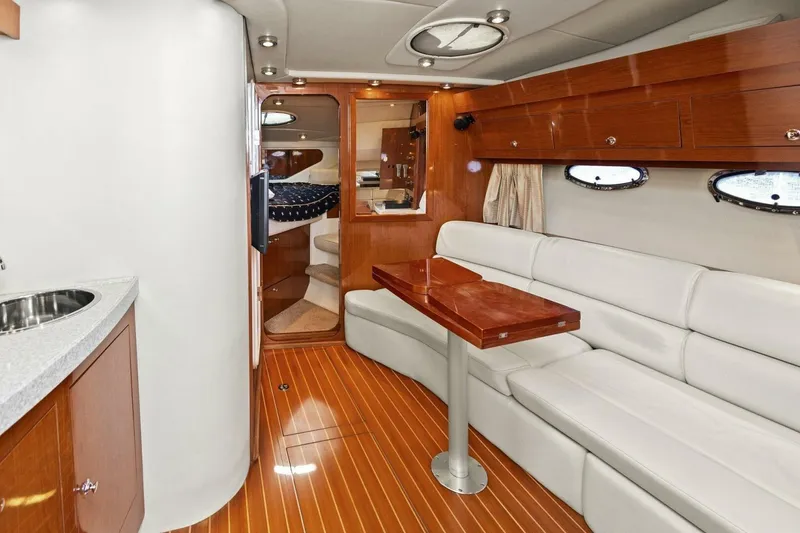 Slide: The Image of Luxurious interior of 2005 Regal Commodore 3560 yacht with elegant wood and leather finishes. - 24