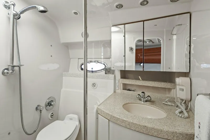 Slide: The Image of Luxurious bathroom in 2005 Regal Commodore 3560 yacht with modern fixtures and elegant design. - 34