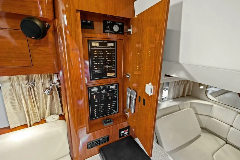 Slide: The Image of 2005 Regal Commodore 3560 yacht interior with control panel and seating area. - 35