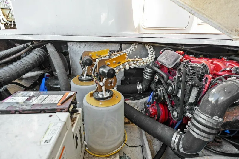 Slide: The Image of Engine compartment of a 2005 Regal Commodore 3560 boat, showcasing mechanical components. - 37
