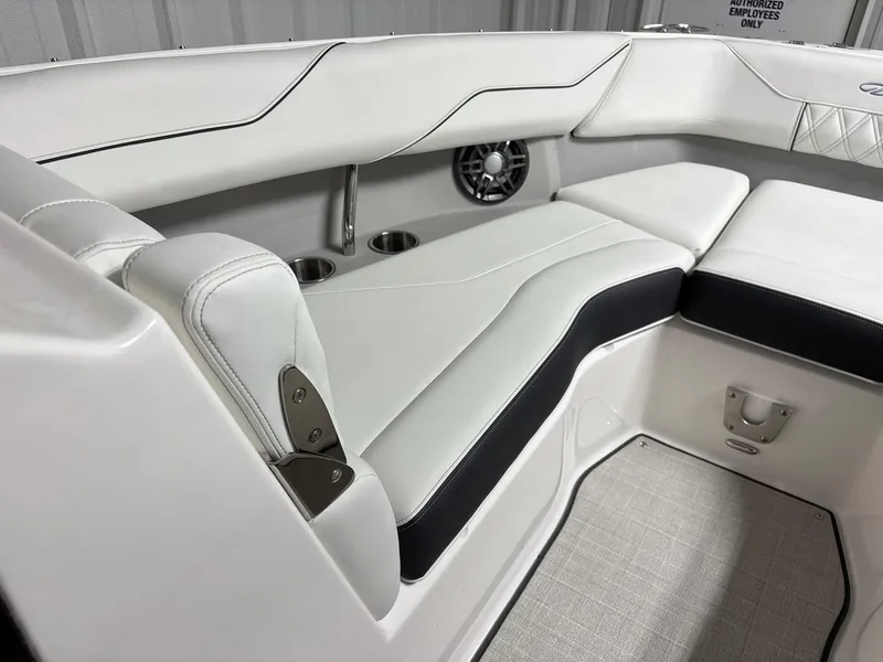 Slide: The Image of Luxurious interior seating of 2026 Regal LX4 boat with cup holders and speaker. - 12
