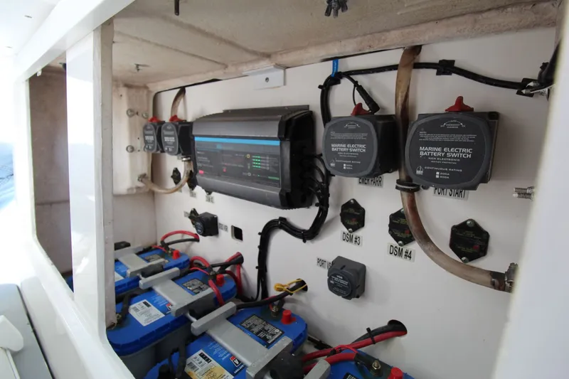 Slide: The Image of Electrical system of a 2009 Everglades 320 Center Console boat, featuring marine battery switches. - 22