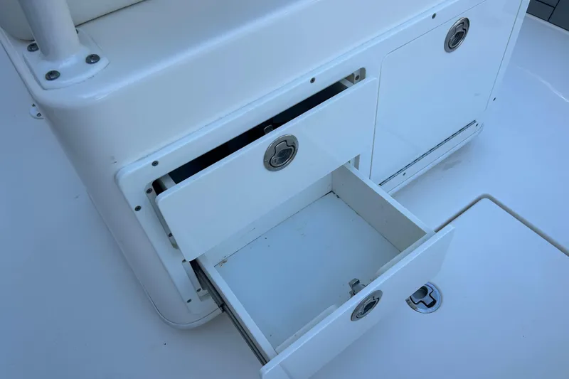 Slide: The Image of Open storage compartment on a 2019 Pathfinder 2600 HPS boat. - 19