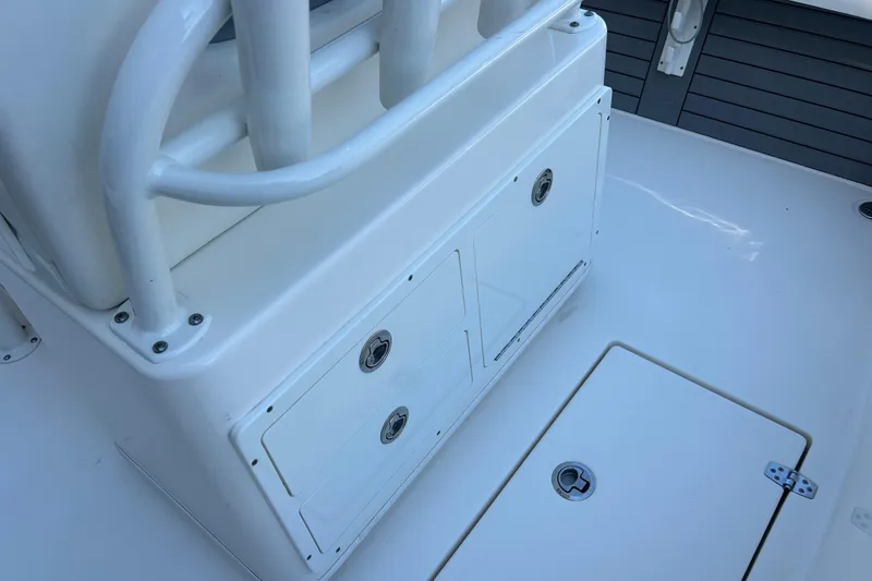 Slide: The Image of 2019 Pathfinder 2600 HPS boat interior with storage compartments and seating. - 20