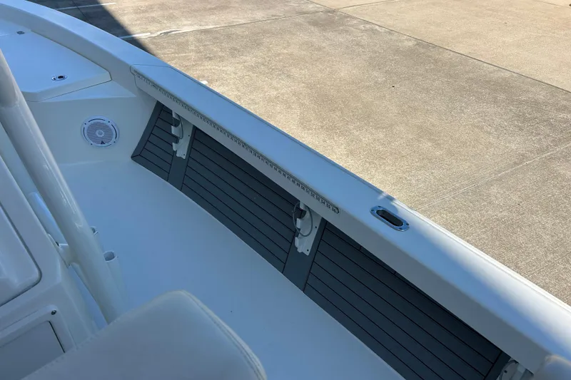 Slide: The Image of 2019 Pathfinder 2600 HPS boat interior with speaker and storage compartments. - 25
