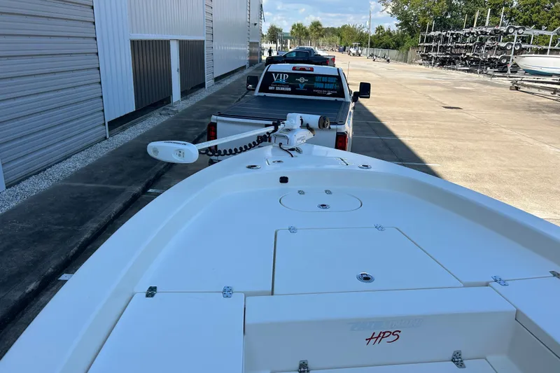 Slide: The Image of 2019 Pathfinder 2600 HPS boat on trailer, parked near storage facility. - 31