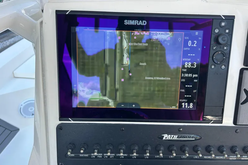 Slide: The Image of Simrad navigation display on 2019 Pathfinder 2600 HPS boat dashboard. - 37