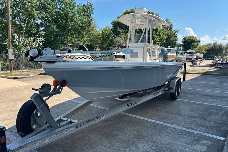 Slide: The Image of 2019 Pathfinder 2600 HPS boat on trailer in parking lot, sunny day. - 4