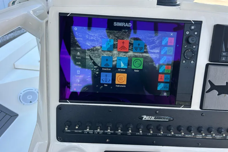 Slide: The Image of Simrad navigation display on 2019 Pathfinder 2600 HPS boat dashboard. - 40