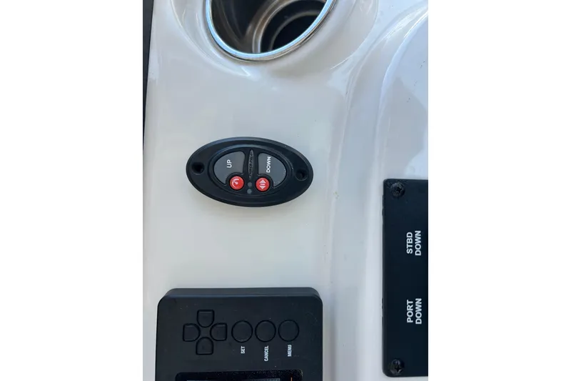 Slide: The Image of Control panel on a 2019 Pathfinder 2600 HPS boat dashboard with buttons and labels. - 41