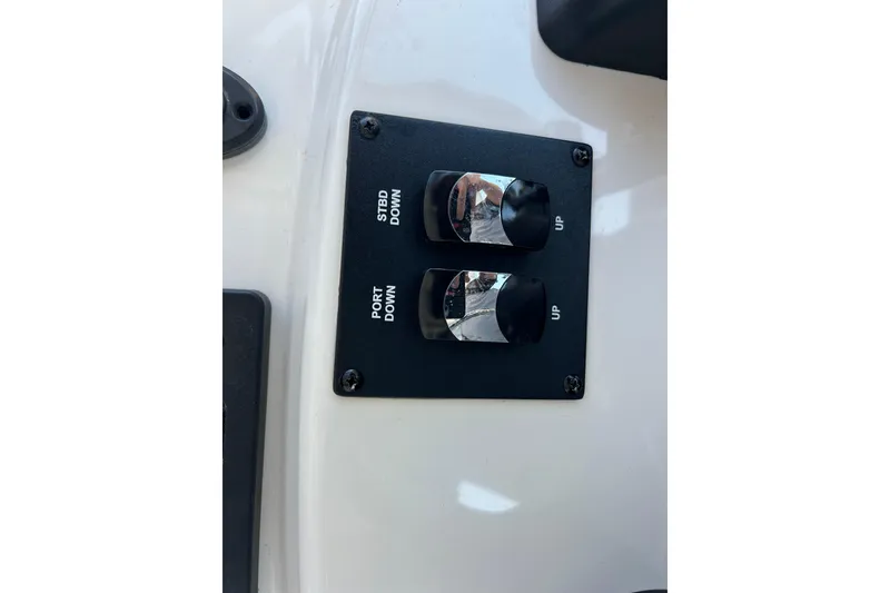 Slide: The Image of 2019 Pathfinder 2600 HPS boat control panel with port and starboard switches. - 42