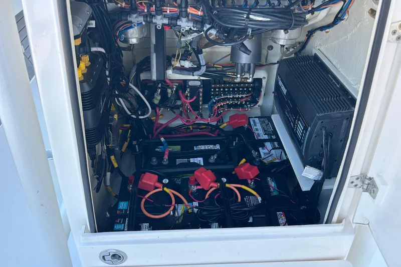 Slide: The Image of Electrical system inside a 2019 Pathfinder 2600 HPS boat, featuring batteries and wiring. - 43